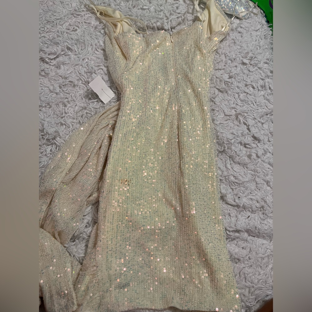 Holographic white sequined formal dress.